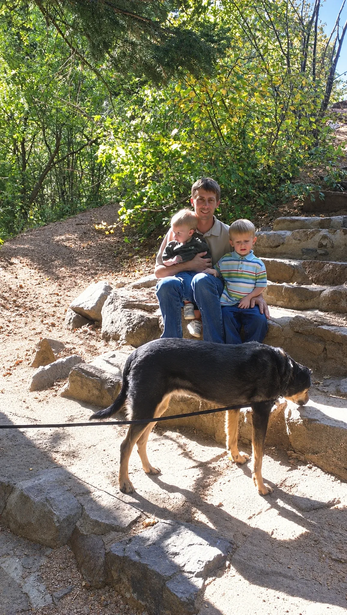 Family With Dogs Outdoors at Pinnacle K9.